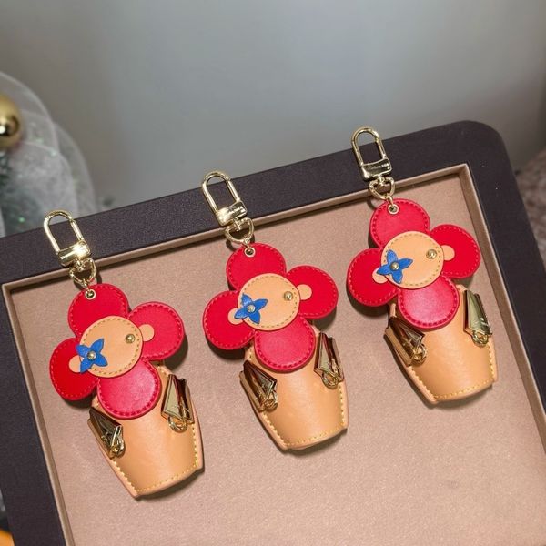 

New Luxury Keychain Bag Charm Designer Key Chain Unisex Car Key Holders Sunflower Keychain Steel Hardware Keyring with Logo Top Quality Gifts Actual product photos