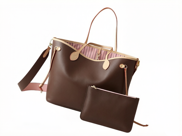 This designer bag showcases a trendy new look with its reversible design, featuring a detachable shoulder strap for convenient crossbody wear.