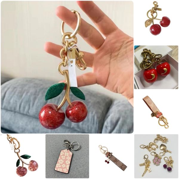 

purse charm designer bag charms keychain bag charm keyring women lanyards leather black red pink key ring wallet keychains designer decoration Cherry car accessory