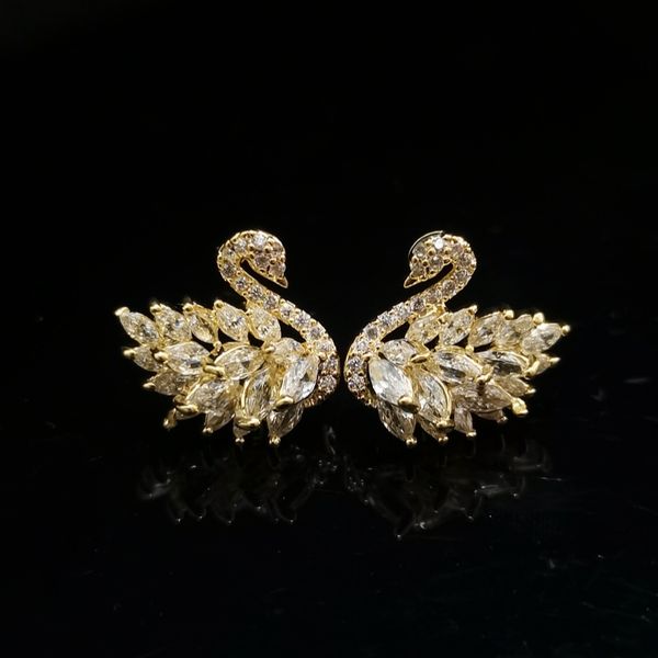 

Designer earring swan shaped zirconium stud earrings with gold-plated copper body and design for high quality and luxury earrings