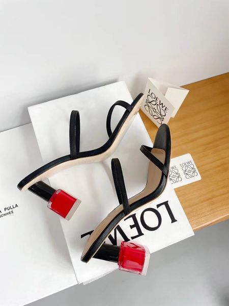 

Spring/Summer Fashion Statement: Elevated Muller Design with Roses and Sharp Heels Available in Black & White