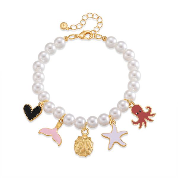 

Exotic handmade bracelet with high gloss pearls, elegant bracelet, ocean elements, shell, starfish, fish tail design