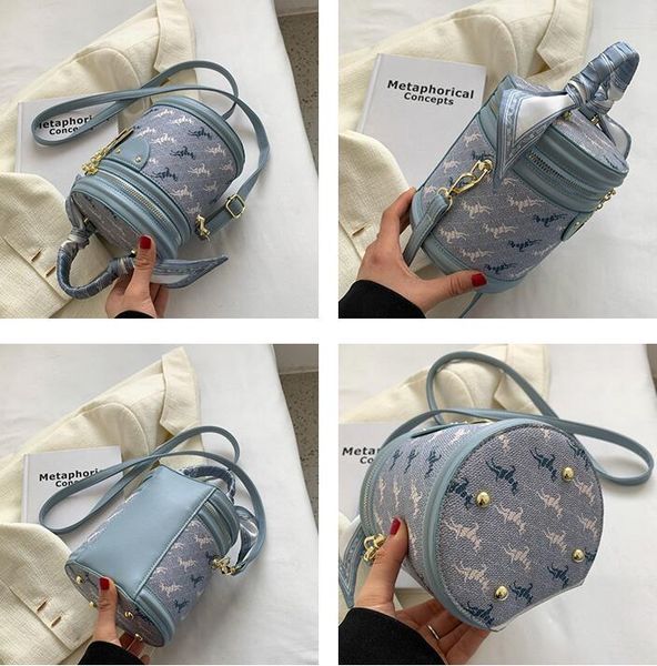 

Womens handbag street cartoon printed shoulder bag sweet lady ribbon handbag niche design contrast leather bucket bag fashion womens backpack factory wholesale, Beige