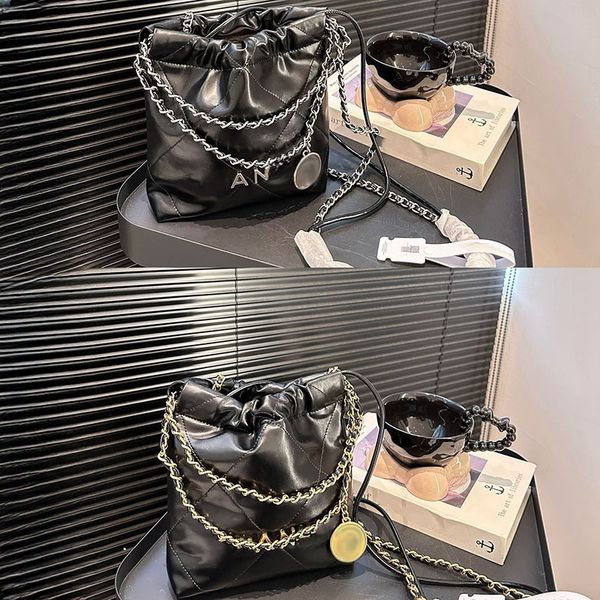 

22 Designer Womens Coin Trash Bag Womens Mini Shoulder Bag Leather Gold Silver Hardware Metal Letter With Gold Coin Crossbody Bag Makeup Bag Luxury C C Tote Bag 19x17cm, Black a