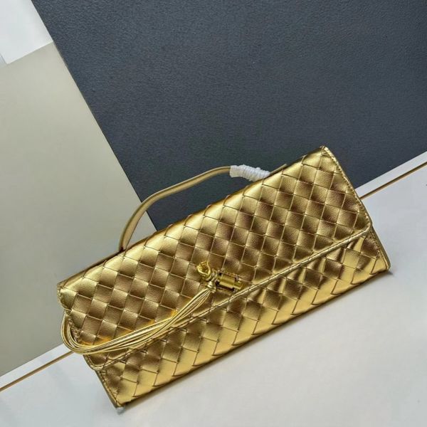 Designer Evening Bag Hottest Most Fashion Gold Clutch Handbag Which Is Woven Leather And Comes With A Handle It Has A Metallic Texture And A Button Closure