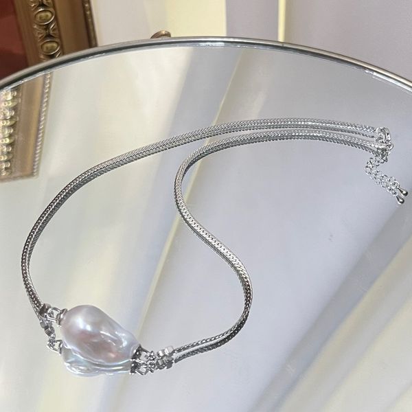

Chic Blue-Toned Pearl Choker with Sophisticated Baroque Accents for Modern Elegance