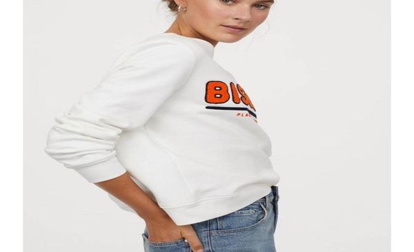

white women sweatshirt fabric soft sweatshirt motif in front and low shoulders slightly wide and long sleeves bisous pattern 202462546, Black