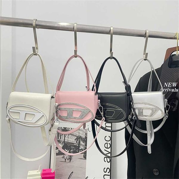 

2023 millennial spicy girl style small crowd design dingdang portable underarm bag female silver single shoulder oblique straddle clearance