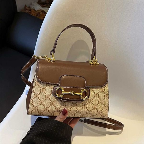 

horseshoe buckle handbag 2023 spring new niche fashion crossbody saddle shoulder bag 50% off outlet store