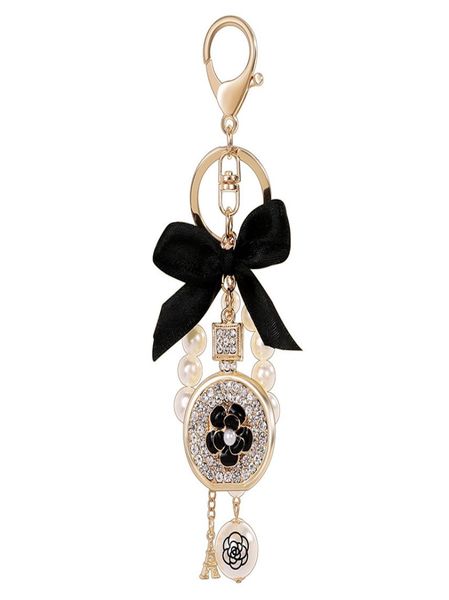 

lovely cute bow pearl flower perfume bottle keychains new fashion ins luxury designer diamond rhinestone bag charms keychains tass6417204, Silver