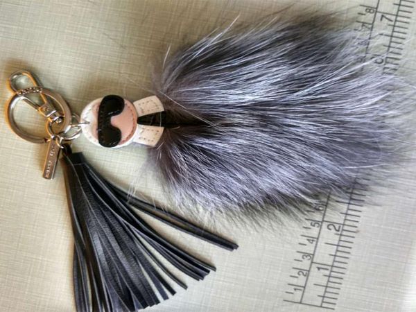 

2020 luxury logo fluffy karl genuine raccoon fur pompom monster bag bugs charm keychain plush key ring leather tassel pompom7522228, Silver