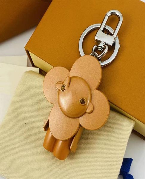 

luxurys designers keychain car key chain monogrammed keychains genuine metallic cartoon humanoid design pendant accessories with h1087027, Silver