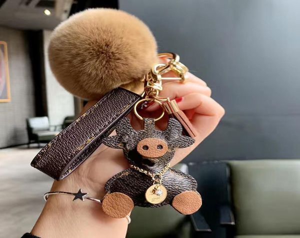 

2022 girls designer keychains canada cattle cow keychain fashion men car keyring holder women bull ox pendant squishm8904287, Silver