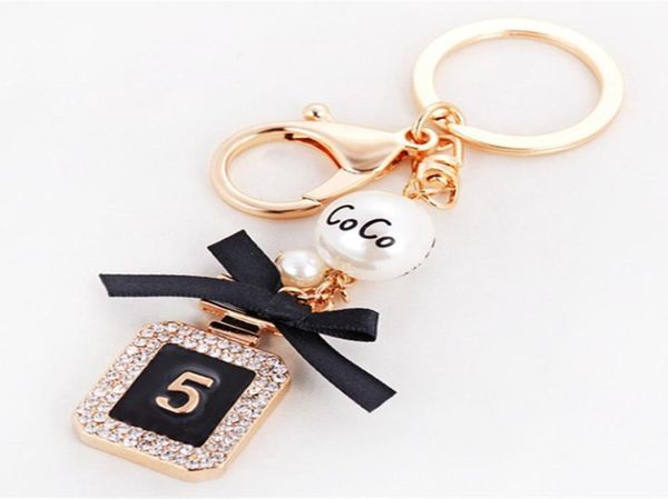 

creative perfume bottle keychain women bag charm crystal rhinestone key chain ring fashion key holder car keyrings trinket5324978, Silver