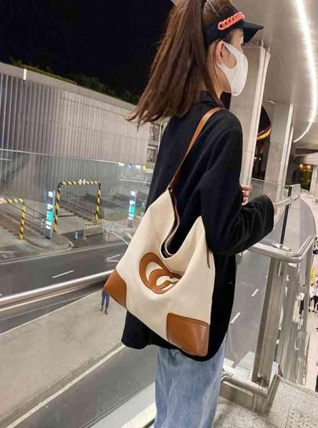 

2022 factory whole large capacity canvas tote autumn trend retro simple shoulder bag student shopping bag female4146381