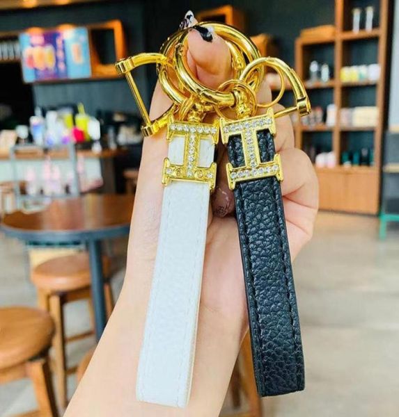 

fashion luxurys keychain bag buckle lovers car keychains handmade leather designers key chains men women bags pendant accessories 3188870, Red;blue