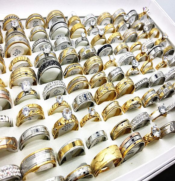 

whole mixed styles 50pcslot men039s women039s silver gold tone rhinestone zircon stainless steel engagement jewelry rin6436127, Slivery;golden
