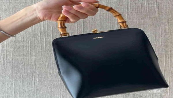 

jil frame mouth gold handbag bamboo festival hand held baguette bag women leather bag women summer 22072524589744652048