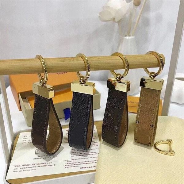 

2022 accessories whole luxury key buckle lovers car keychain handmade designer genuine leather men women bags pendant239g, Black