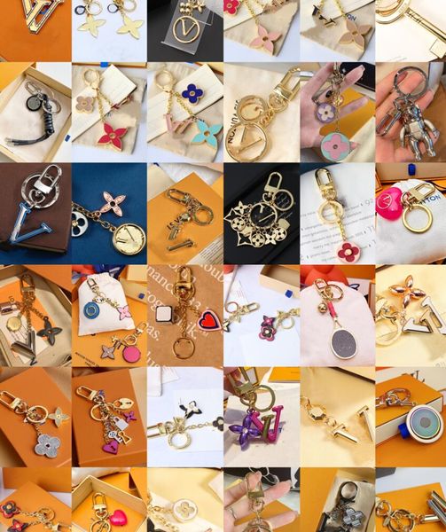 

luxury brand womens key wallets metal four leaf grass keychain ladies bags totes pendant mens car keychain designer female bags pendants acc, Red;blue