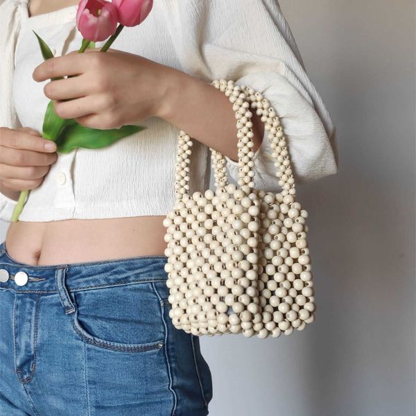 

fashion wooden beading women handbags designer hollow small tote bag handmade summer beach vintage simple bucket purses 2023 230129