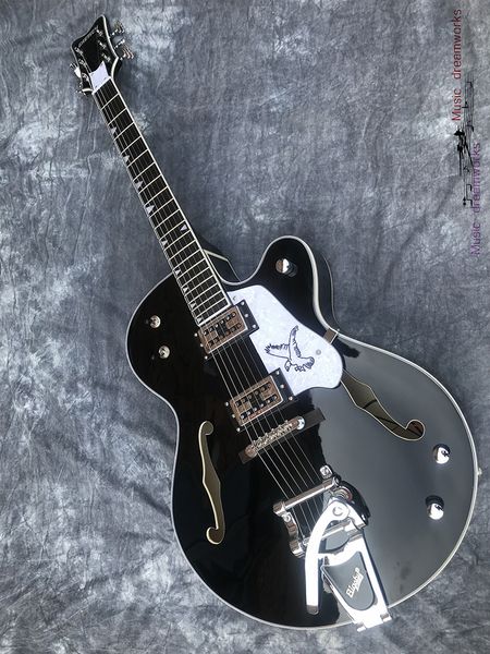 

custom electric guitar, double f hole thick body jazz guitar, mahogany fingerboard, large vibrato bridge