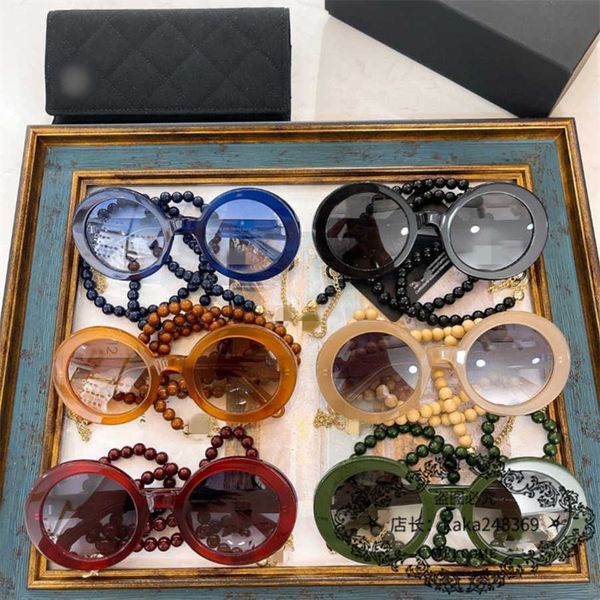 

2023 luxury designer sunglasses 23 new family style round frame women's net red pearl chain sunglasses ch5489, White;black