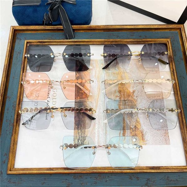 

2023 new luxury designer g family's new fashion crystal diamond star rivet frameless square ni ni's same sunglasses gg0644, White;black