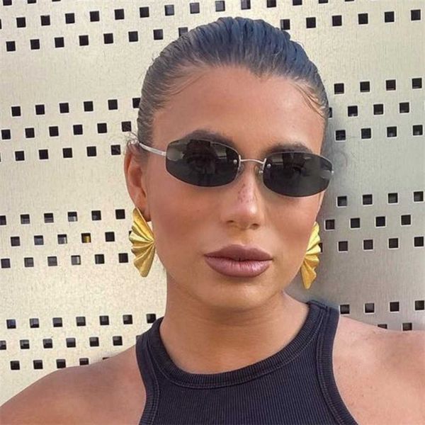 

2023 new luxury designer xiaoxiang's personality frameless oval ins star of the same style sunglasses female ch4322, White;black