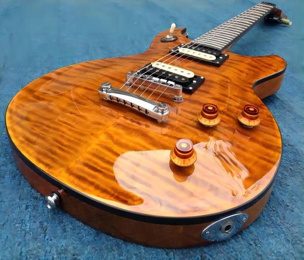 

custom tak matsumoto signature quilted maple orange electic guitar abalone trapezoid inlay, black body binding, tuilp tuners, chrome hardwar