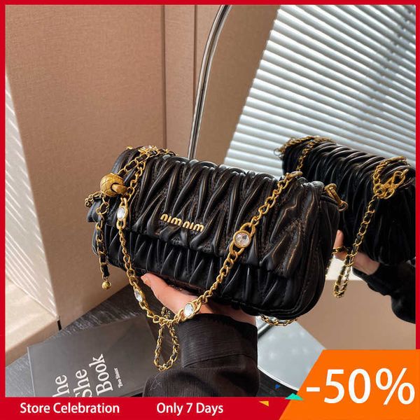 

french niche for women in spring and summer 2023 new versatile chain crossbody foreign style small square bag
