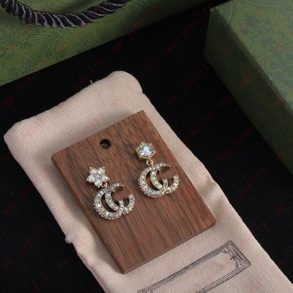 

left and right sides of asymmetrical crystal flower stud inlaid zircon alphabet pendant for women charm earrings, brass material with person, Golden