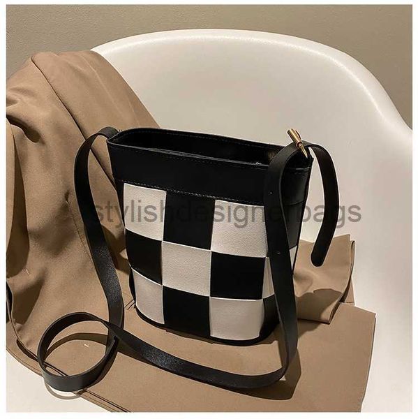 

2023 summer new minimalist chessboard plaid cowhide versatile bucket bag for women with large capacity niche one crossbody bagstylishdesigne
