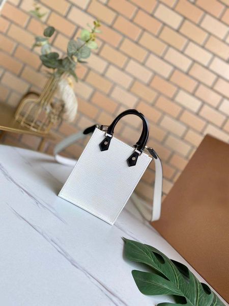 

luxury mini bag petitsacplathandbags slung over one shoulder.