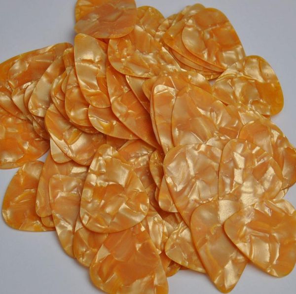 

lots of 100 pcs medium 071mm guitar picks plectrums celluloid pearl orange4346532