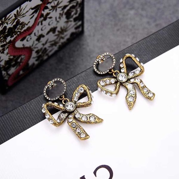 

Luxury GU brand fashion jewelry big-name accessories Art Rococo Style Bow Knot Ancient Home Brass Material Inlaid with Diamonds English Letter Old Ear Studs Female