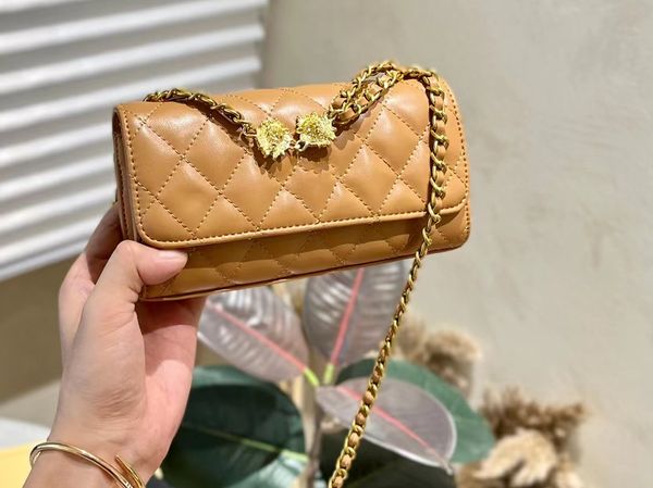 

luxury design fashion women's classic retro little lion bag rotating button design small and exquisite elegant leather crafted handheld