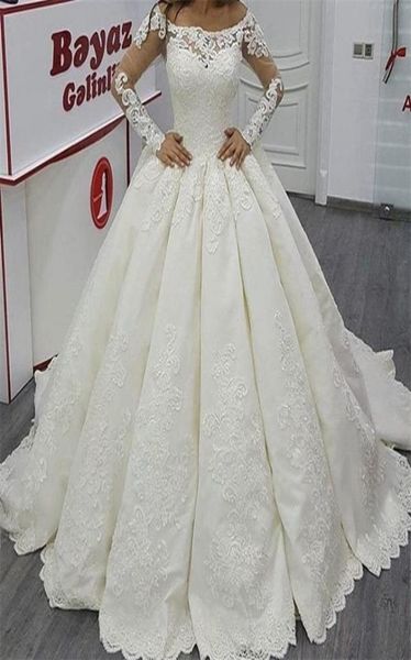 

2017 bateau ball gown wedding dresses illusion long sleeves major lace appliqued floor length sweep train bridal gowns1847522, White