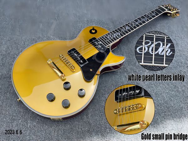 

electric guitar with letters, p90, soapy shape pickup, brown back, gold part, pearl white inlay, part, black