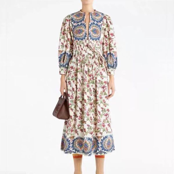 

australian designer dress with paisley pattern embellishments and fruit printed lantern sleeves, medium length dress, Black;gray