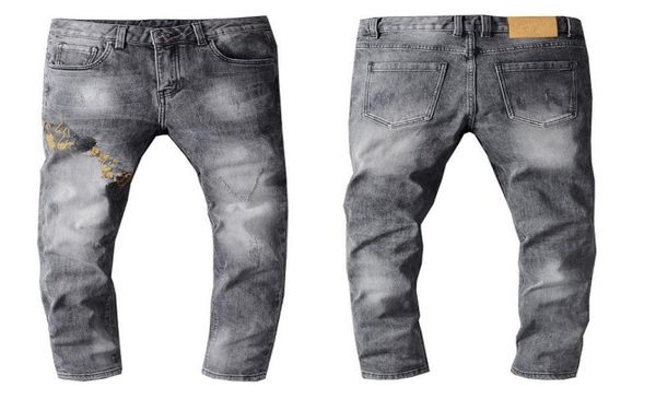

latest listing design winter mens jeans blue good quality designer spray paint spliced ripped high street destroyed denim trousers8389115