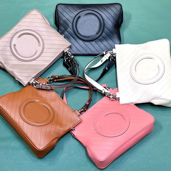 

inspired by the symbolic elements of the fashion designer collection, the round interlocking medium tote bag comes with a handle and chain s