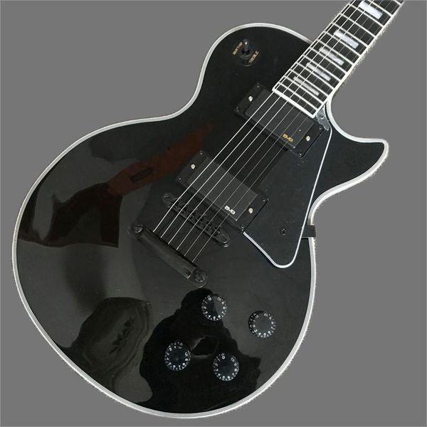 

black electric guitar, ebony binding, black hardware electric guitar