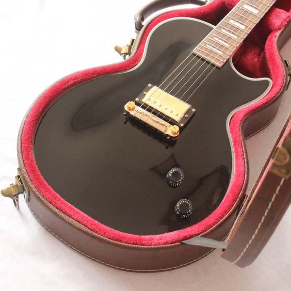 

custom electric guitar, black finish, 1 set of bridge pickups, gold plated parts,