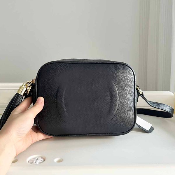 

genuine leather camera bag with beautiful and versatile double letter emed design zipper closure canvas lining tassel decoration