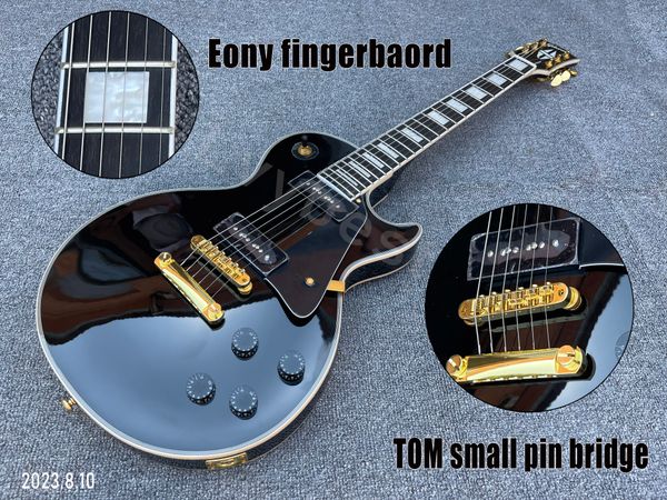 

electric guitar solid black mahogany body and neck p90 pickups black pickguard gold parts small pin bridge ebony fingerboard block inlay
