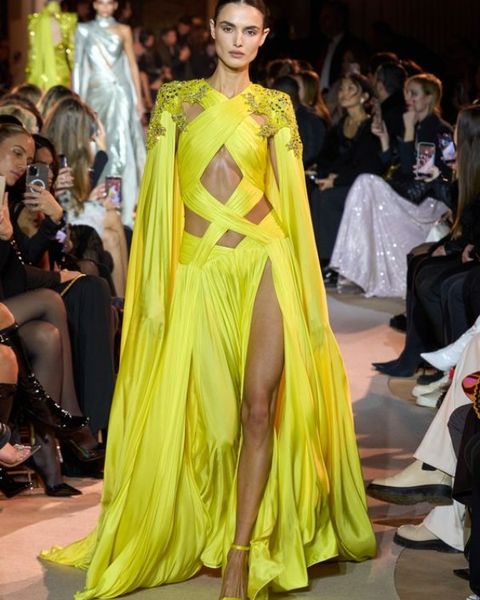 

wearing a yellow slit evening dress with sequins on both shoulders at the latest launch of zuhair murad brand in 2023., Black;pink