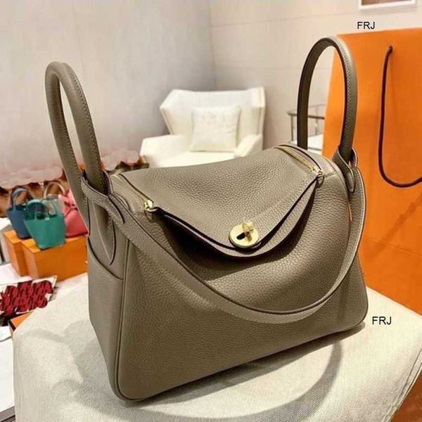 

designer lindi bags 2023 new versatile mother cowhide doctor bag leather womens one shoulder portable pill lzkv have logo frj