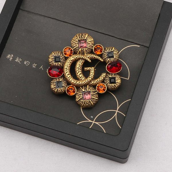 

fashion collection 2023 new luxury fashion jewelry for new hollowed out color diamond zircon inlaid brooch anti light coat pin female, Gray
