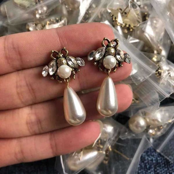 

70% off 2023 new luxury fashion jewelry for pearl bee eye drill bronze personality ear stud net red ornament 19-24, Golden